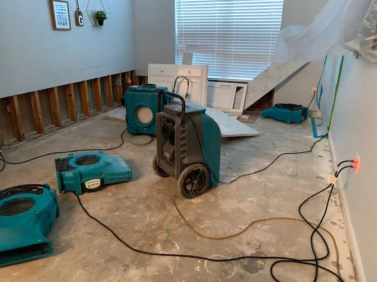 Dehumidifier in flood-cut room for Water Damage Restoration in Travilah