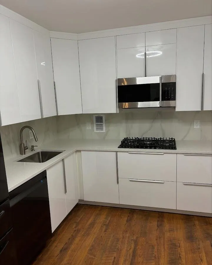 Restored kitchen with white cabinets after water damage in Travilah